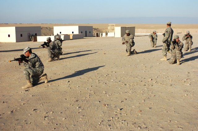 Cavalry scouts from 4th Squadron, 9th Cavalry Regiment, 2nd Brigade Combat Team, 1st Cavalry Division, work on movement formations at a range outside of Camp Buehring, Kuwait Jan. 15. The Soldiers are taking part in a dismounted training course...