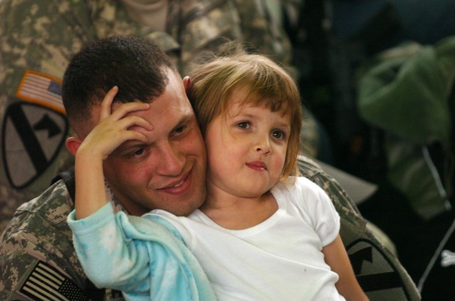 San Jacinto, Calif. native Staff Sgt. Adolfo Mora, Headquarters Support Company, Division Special Troops Battalion, 1st Cavalry Division, spends some quality time at Raider Gym on Fort Hood, Texas, with his 4-year-old daughter Eliana at Ironhorse...