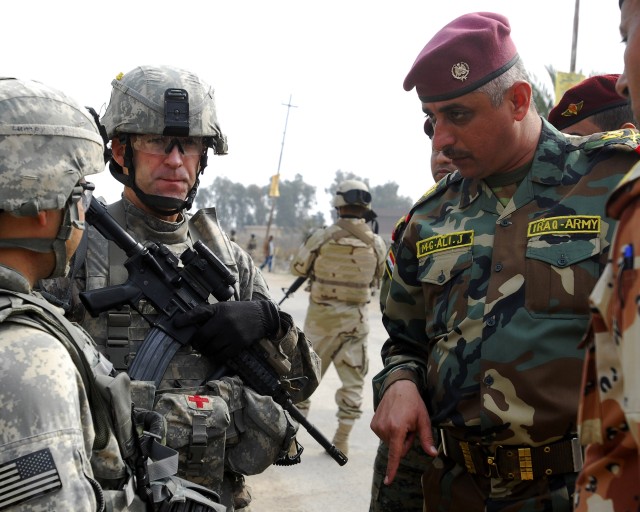 Partnership between Iraqi, 1st Armored Division Soldiers helps keep provincial elections safe