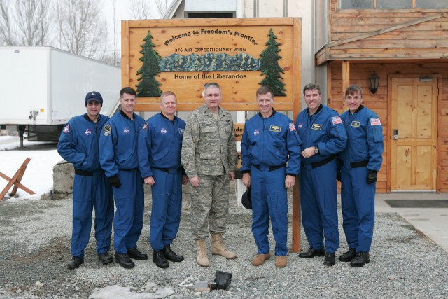 The crew poses with the vice commander of the 376th Air Expeditionary Wing stationed at Manas Air Base, Kyrgyzstan. Pictured are (left to right): Don Pettit, Shane Kimbrough, Eric Boe, Colonel James Pfaff, Chris Ferguson, Stephen Bowen and Heidemarie...