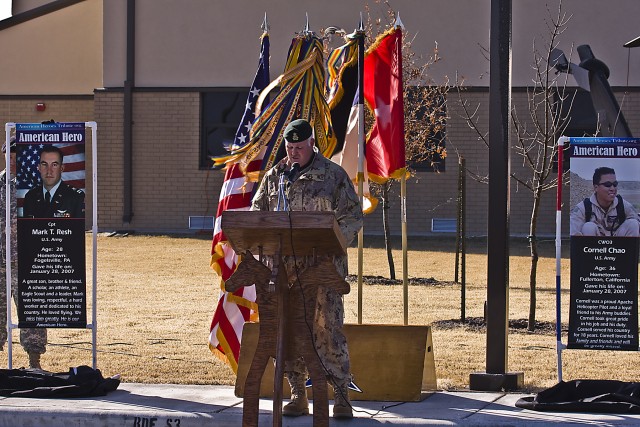 Flanked by banners of Capt. Mark Resh (left banner) and Chief Warrant Officer 3 Cornell Chao (right banner) Canadian Army Brig. Gen. Peter Atkinson, III Corps Deputy Commanding General and guest speaker at the 1st Air cavalry Brigade, 1st Cavalry...