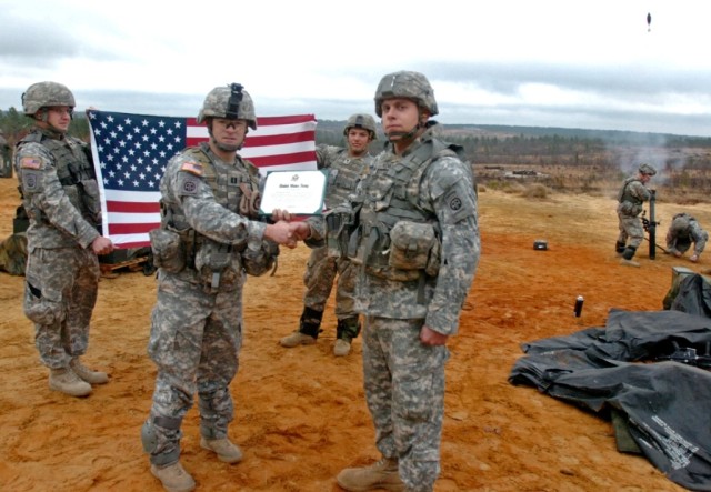 Fort Bragg NCO Re-enlists on mortar range 
