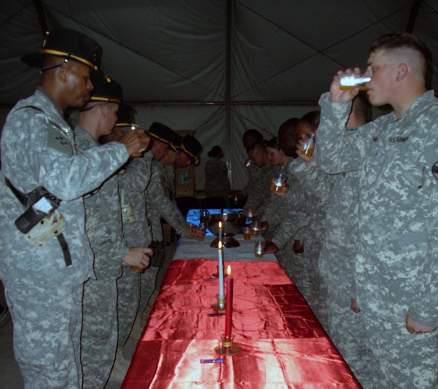 1st Sgt. Curtis Jones and noncommissioned officer nominee Sgt. Rowdy Yager, from the 27th Brigade Support Battalion, 4th Brigade Combat Team, 1st Cavalry Division, drank their glasses of punch during the final phases of the battalion's...