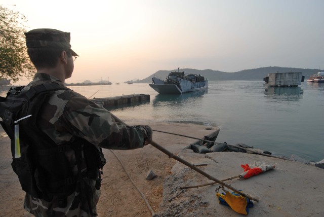Amphibious dock landing ship USS Tortuga (LSD 46) off loads Marines