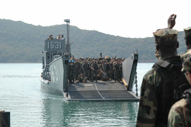 Amphibious dock landing ship USS Tortuga (LSD 46) off loads Marines