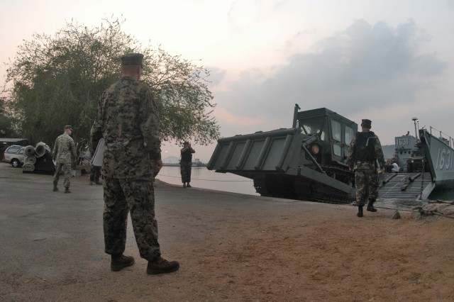Amphibious dock landing ship USS Tortuga (LSD 46) off loads Marines