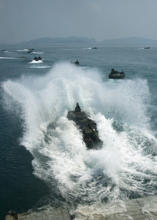 Amphibious dock landing ship USS Tortuga (LSD 46) off loads Marines