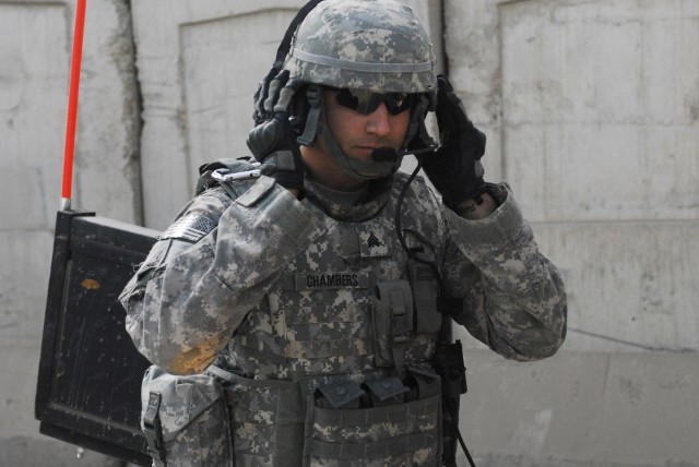 Sgt. Patrick Chambers, personal security detachment team leader, 2nd Heavy Brigade Combat Team, 1st Infantry Division, Multi-National Division-Baghdad, gears up for a mission to escort the "Dagger's" brigade command sergeant major throughout the...