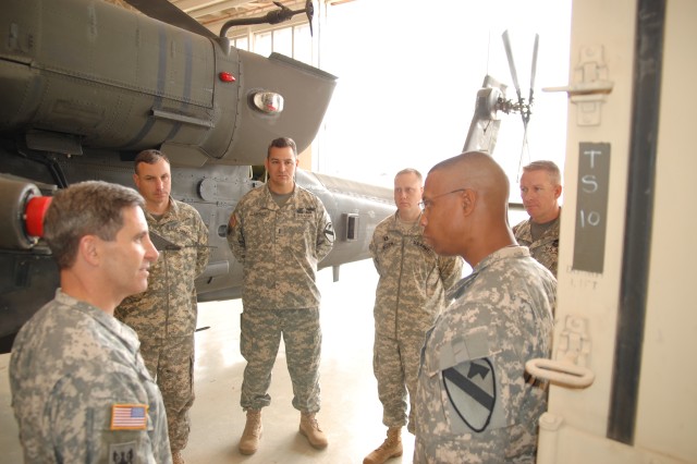 Brigadier General William Wolf (front left), commanding general of the U.S. Army Combat Readiness/Safety Center in Fort Rucker, Ala., shares his concerns about safety with Lt. Col. Charles Dalcourt (front right), commander of 1st Attack Reconnaissanc...