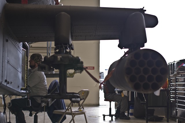 Civilian contractor Shawn Hudson of Enterprise, Ala., is part of the contracting team performing modifications on AH-64D Apache helicopters for the 4th Attack Reconnaissance Battalion, 227th Aviation Regiment, 1st Air Cavalry Brigade, 1st Cavalry Div...