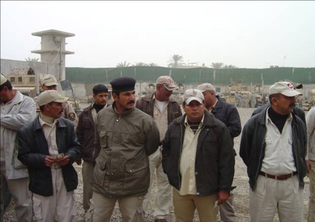BAGHDAD - Members of the Sons of Iraq wait for their pay from the Iraqi Government in the Mansour district of northwest Baghdad Feb. 10. Iraqi Soldiers from the 2nd Battalion, 54th Brigade, 6th Iraqi Army Division provided security for the event...