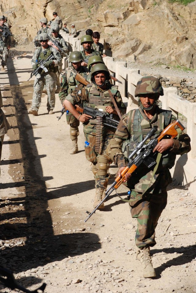 US Soldier and Afghan Army on Patrol