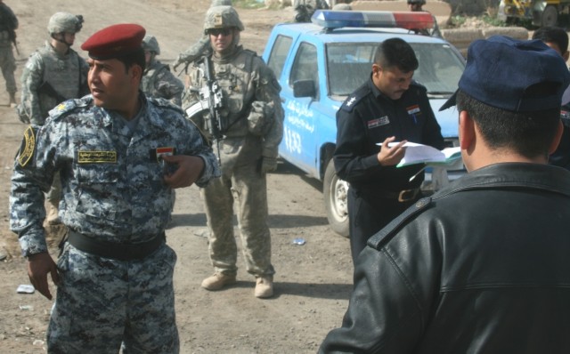 RASHIDIYAH, Iraq -Soldiers assigned to 1st Battalion 27th Infantry Regiment, 2nd Stryker Brigade Combat Team, 25th Infantry, partner with officers assigned to the 2nd Bde., 1st Iraqi National Police Div. and Iraqi police officers from the Al...