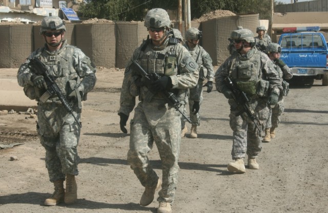 RASHIDIYAH, Iraq - Capt. Brian Sweigart (left), 1st Battalion, 27th Infantry Regiment, 2nd Stryker Brigade Combat Team, and Capt. William Grozinski, 1st Bn., 112th Inf. Regt., 56thSBCT, 28th Inf. Div., Pennsylvania Army National Guard, lead a...