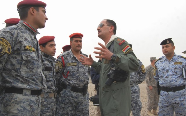 JOINT SECURITY STATION ISTAQLAL, Iraq – National Police Officers assigned to the 2nd Battalion, 2nd Brigade, 1st National Police Division listen to a pre-mission brief Feb. 14 at Joint Security Station Istaqlal in preparation for an air assault...