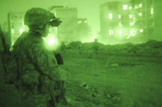 JOINT SECURITY STATION MUTHANA, Iraq - Paratroopers assigned to 5th Squadron, 73rd Cavalry Regiment, 3rd Brigade Combat Team, 82nd Airborne Division, perform a nighttime foot patrol with Iraqi Police officers Feb. 16 in the Rusafa district of...