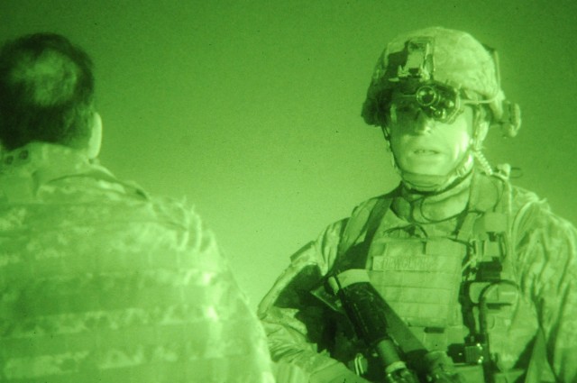JOINT SECURITY STATION MUTHANA, Iraq - Staff Sgt. Anthony Dewolfe (right), a native of Edmond, Okla., a squad leader assigned to Troop B, 5th Squadron, 73rd Cavalry Regiment, 3rd Brigade Combat Team, 82nd Airborne Division, talks to his...