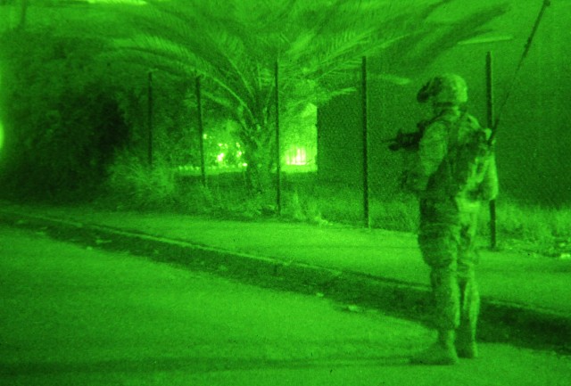 JOINT SECURITY STATION MUTHANA, Iraq - A Paratrooper assigned to Troop B, 5th Squadron, 73rd Cavalry Regiment, 3rd Brigade Combat Team, 82nd Airborne Division, checks out his surroundings during a nighttime foot patrol Feb. 16 in the Rusafa...