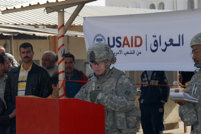 BAGHDAD - Lt. Col. Doug Kirby, commander, 4th Battalion, 42nd Field Artillery Regiment, speaks during the re-opening ceremony for the Shawaka Fish Market in the Karkh district of northwest Baghdad Feb. 18. Kirby and his Soldiers in the 4th Bn....