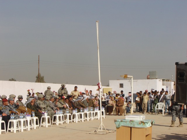Baghdad- Local community leaders (governmental and tribal), Iraqi Security Forces and Soldiers of Task Force 1st Battalion, 35th Armor Regiment, MND-B, observe the festivities during the ribbon cutting celebration at the Al Ghasacena Primary...