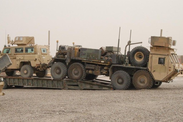 CAMP LIBERTY, Iraq - Soldiers from the recovery section unload an RG-31, route clearance vehicle, in the 890th Engineer Battalion's motor pool for maintenance.  Soldiers from the 890th Engineer Battalion, 926th Engineer Brigade, Multi-National Nation...