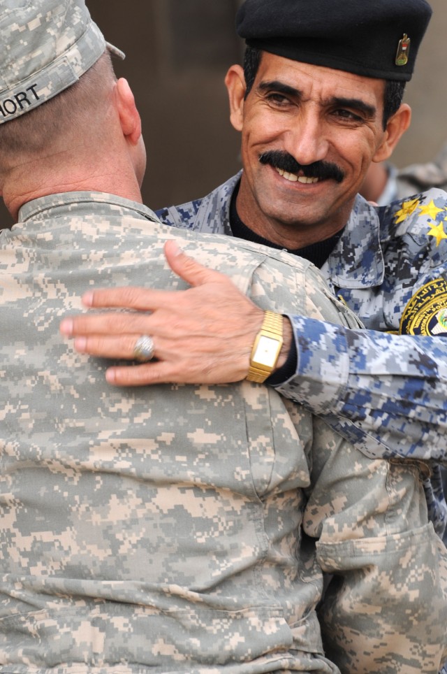 FORWARD OPERATING BASE LOYALTY, Iraq - Iraqi Brig. Gen. Ali Ibraheem Dabown, commander of the 8th National Police Brigade, 2nd NP Division, says farewell to Col. John Hort, commander of the 3rd Brigade Combat Team, 4th Infantry Div., during a transit...