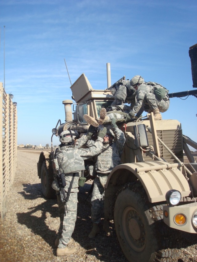 CAMP TAJI, Iraq – “Cobra” Soldiers of the 848th Engineer Company, 890th Engineer Battalion, 225th Engineer Brigade, prepare to lift a battle buddy to safety during casualty evacuation drills Feb. 16. The 848th Eng. Co., based out of Douglas,...