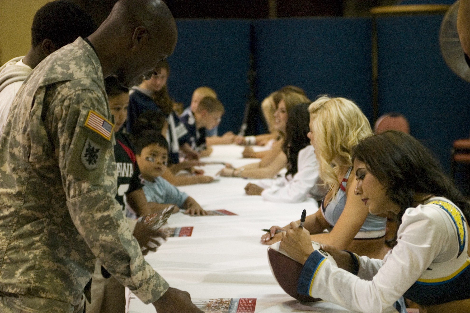 St. Louis Rams cheerleaders entertain the crowds in camouflage