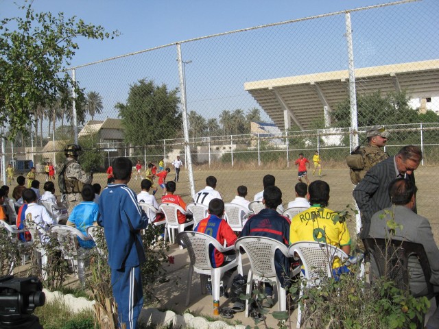BAGHDAD - Local soccer players watch a tournament match at the Zawra Soccer Stadium in the Karkh district of northwest Baghdad Feb. 17. Soldiers, serving with the 4th Battalion, 42nd Field Artillery Regiment, delivered soccer equipment to the players...
