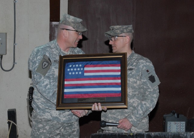 CAMP TAJI, Iraq -  Lt. Col. Thomas Boccardi (left), commander, 1st Battalion, 14th Infantry Regiment, 2nd Brigade, 25th Infantry Division, accepts a framed Franklin Flag from Lt. Col. Mark O'Hanlon (right), of Wallingford, Pa., commander of the...