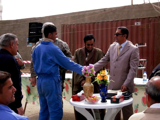 BAGHDAD - A graduate of a generator repair course is congratulated at a ceremony Feb. 23 in the Karkh district of northwest Baghdad. Through the Demilitarization, Demobilization and Reintegration program, members of the Sons of Iraq and recently...
