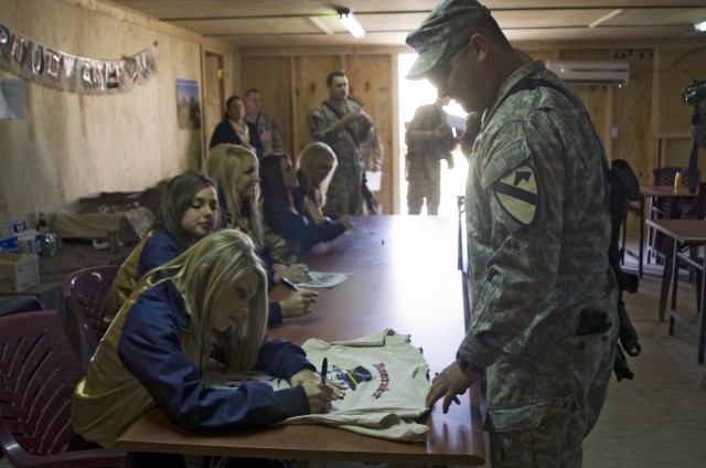 The St. Louis Rams cheerleaders of St. Louis, Miss. visited combat outpost Apache and it's Soldiers with 1st Battalion, 12th Cavalry Regiment, 3rd Heavy Brigade Combat Team in Ninewah province, Iraq Feb. 18 as part of their tour of the region....