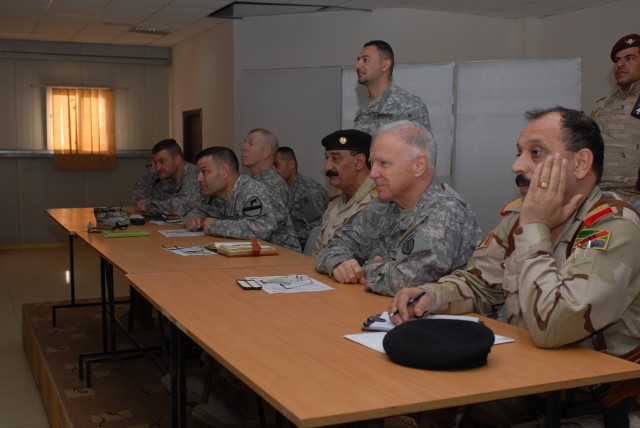 Leaders from the 12th Iraqi Army Division and 2nd "Black Jack" Brigade Combat Team, 1st Cavalry Division, sit together at a meeting Feb. 5 at K-1, a military base in Kirkuk Province. This meeting was an opportunity for the leaders to meet the...