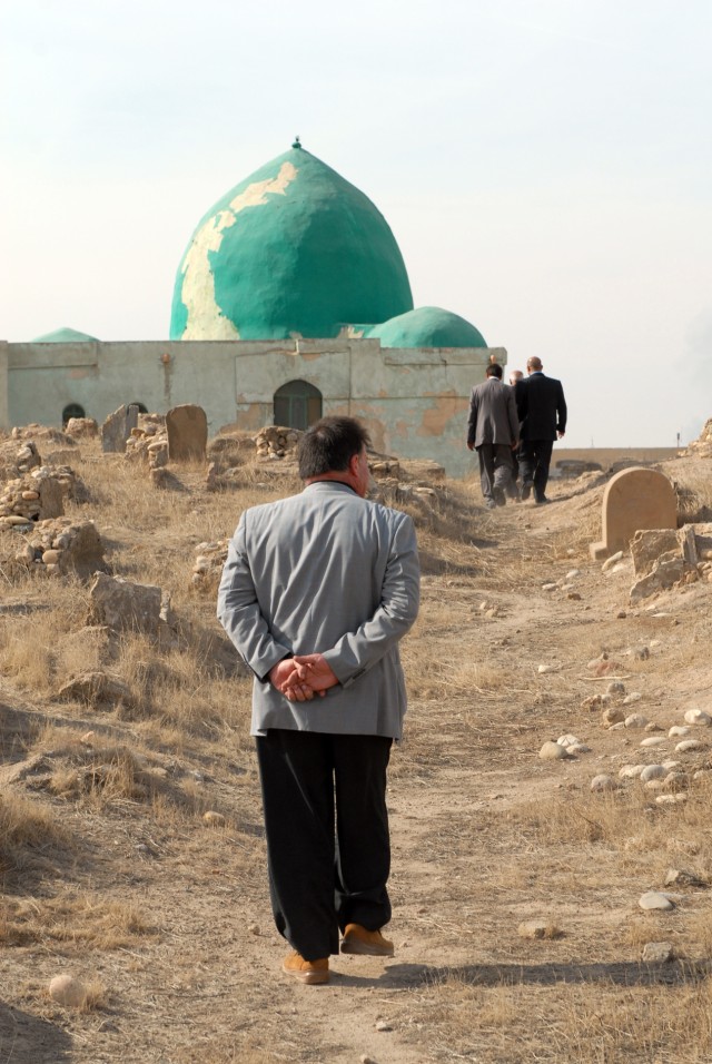 A local religious leader lends his support to arranging future visits to the Sultan Saqi shrine on Forward Operating Base Warrior, Kirkuk, Iraq, Feb. 5. The nearly 700 year old shrine holds what local citizens believe to be the bodies of distant rela...