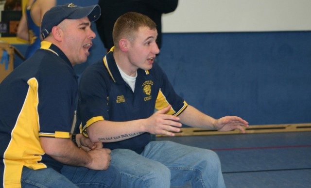 NCO volunteers as youth wrestling coach