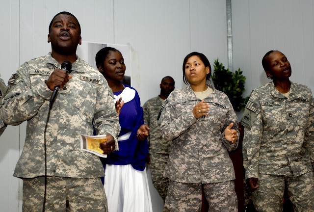 BAGHDAD - Soldiers of the Camp Striker Choir perform a traditional version of the gospel song "Down by the Riverside" during the 2nd Brigade Combat Team, 1st Armored Division's Black History Month observance luncheon in the VIP room of the Camp...