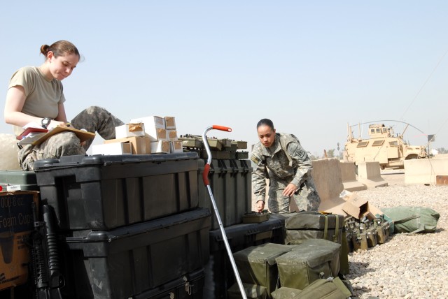 CAMP LIBERTY, Iraq - After arriving to Camp Liberty, Spc. Nicole Delia (left), of Clifton Park, N.Y. and Pfc. Stephanie Malave, of Waterbury, Conn., both of the 340th MP Co., 91st MP Battalion, 8th MP Brigade, inventory chemical, biological,...
