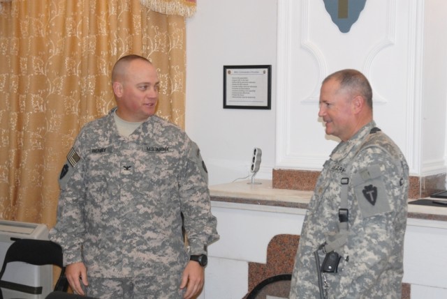 BAGHDAD - Col. Lee Henry (left), commander of the Texas Army National Guard's 56th Infantry Brigade Combat Team, 36th Infantry Division, Multi-National Division-Baghdad, talks to his Inspector General, Maj. Dean Dahle, of Wendell, Minn. prior to...