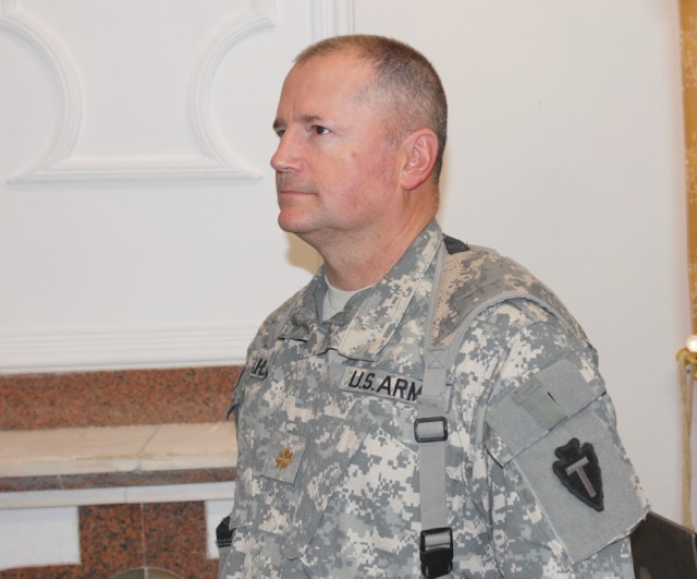 BAGHDAD - Maj. Dean Dahle, the Inspector General for the 56th Infantry Brigade Combat Team, 36th Infantry Division, Multi-National Division-Baghdad, stands at attention as orders for his promotion to lieutenant colonel are read during a promotion...