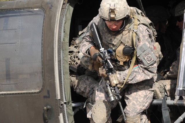 FORWARD OPERATING BASE LOYALTY, Iraq - Staff Sgt. Matthew Guza, a native of Cameron, N.C., assigned to Troop B, 5th Squadron, 73rd Cavalry Regiment, 3rd Brigade Combat Team, 82nd Airborne Division, Multi-National Division-Baghdad, exits an UH-60...