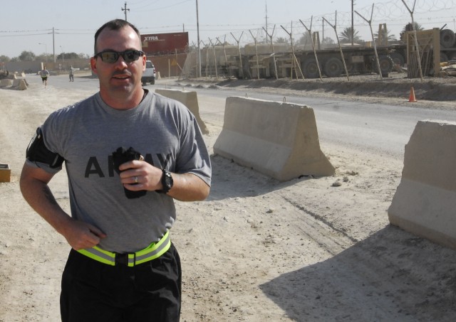 BAGHDAD - Staff Sgt. Marcus Hooks, of Kingston Tenn., 2nd Battalion, 6th Infantry Regiment, 2nd Brigade Combat Team, 1st Armored Division, goes running on Camp Striker to keep physically fit and relieve stress while on his scheduled fifteen month...