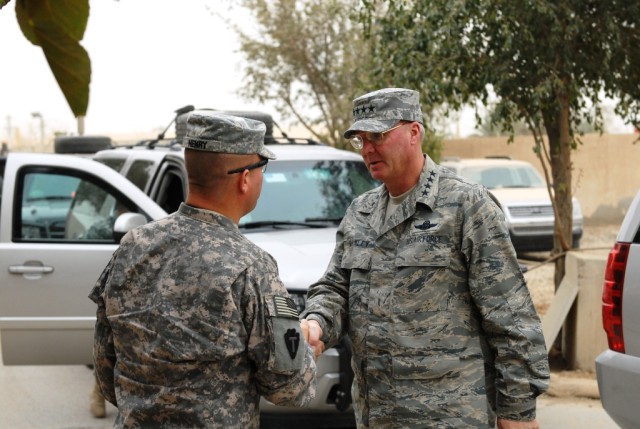 BAGHDAD - Col. Lee Henry(left), commander of the 56th Infantry Brigade Combat Team, Multi-National Division-Baghdad, greets  Gen. Craig McKinley, Chief of the National Guard Bureau during a visit to Victory Base Complex Mar. 1. Henry, a Texas Nationa...