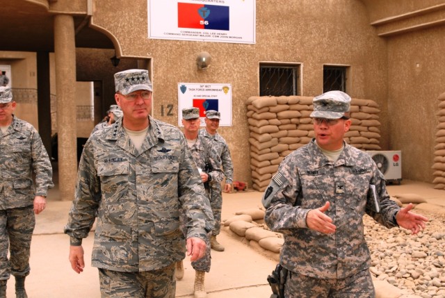 BAGHDAD - Gen. Craig McKinley (left), Chief of the National Guard Bureau, gets a walking tour of the Base Defense Operations Center area from Col. Lee Henry, commander of the 56th Infantry Brigade Combat Team, Multi-National Division - Baghdad, durin...