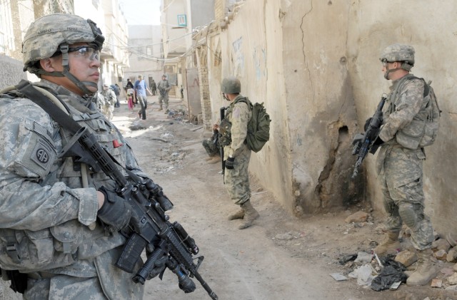 RASHEED, Iraq - Paratroopers assigned to 5th Squadron, 73rd Cavalry Regiment, 3rd Brigade Combat Team, 82nd Airborne Division and Iraqi Army Soldiers check their surrounds inside an alleyway during Operation Sway Sway, a combined operation...