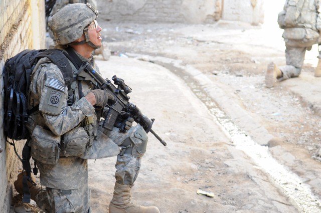 RASHEED, Iraq - A U.S. Paratrooper assigned to 5th Squadron, 73rd Cavalry Regiment, 3rd Brigade Combat Team, 82nd Airborne Division provides security and checks his surrounds during Operation Sway Sway Feb. 28 in the Rusafa district of eastern...