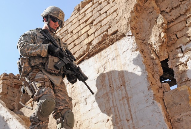 RASHEED, Iraq - 2nd Lt. James Kirby, of Williamsburg, Mich., a platoon leader with Troop A, 5th Squadron, 73rd Cavalry Regiment, 3rd Brigade Combat Team, 82nd Airborne Division, walks down a flight of steps after clearing a building during...