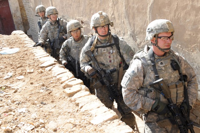 RASHEED, Iraq - Paratroopers assigned to 5th Squadron, 73rd Cavalry Regiment, 3rd Brigade Combat Team, 82nd Airborne Division, walk in an alley as they prepare to enter a home in search of weapons caches during Operation Sway Sway Feb. 28 in the...