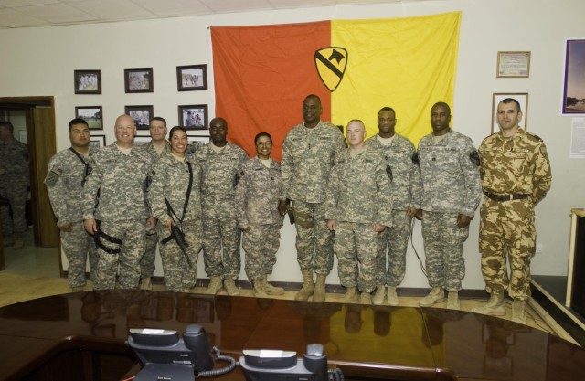 Lt. Gen. Lloyd Austin III, the commander of Multi-National Corps - Iraq, poses with troops who received commendation coins from him and leaders from the 4th Brigade Combat Team, 1st Cavalry Division, the 407th Air Expeditionary Groups and the...