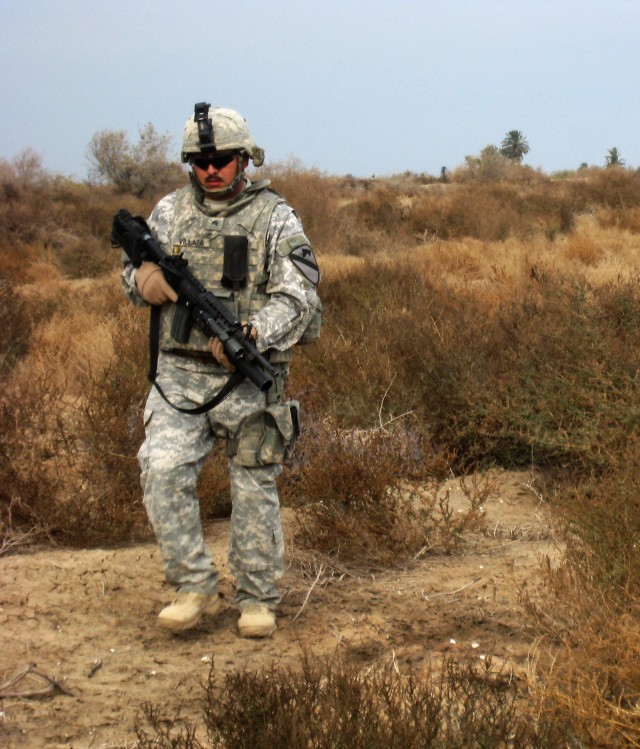 Sgt. Ader Villalta, from Los Angeles, Calif., and assigned to the 5th Battalion, 82nd Field Artillery Regiment, 4th Brigade Combat Team, 1st Cavalry Division, patrols during 'Operation Long Island.' The operation was a joint patrol conducted with Ira...