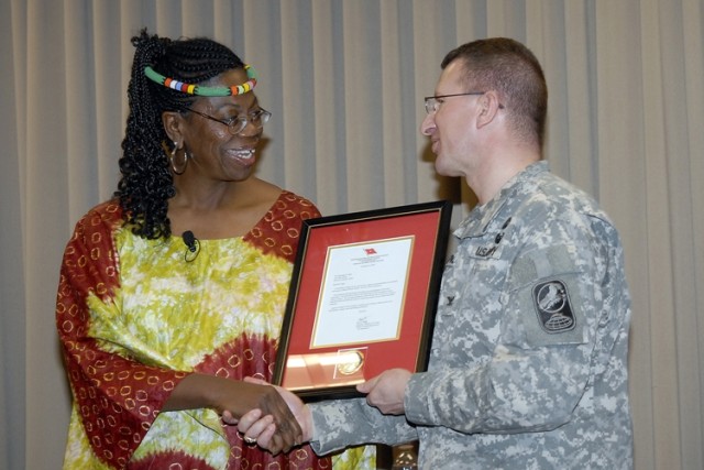 Yowell Presents Plaque of Recognition to Pugh